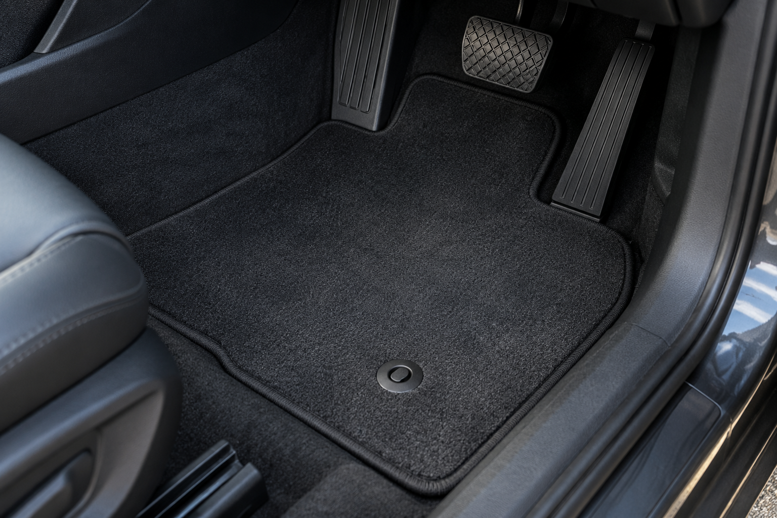 Illustrative footwell showing the mat edge and floor fixing